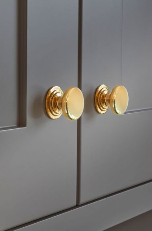 Waltz Round Kitchen Cupboard Knob on Stepped Rose 32mm in Polished Brass Lacquered - by Alexander & Wilks - AW825-32-PBL